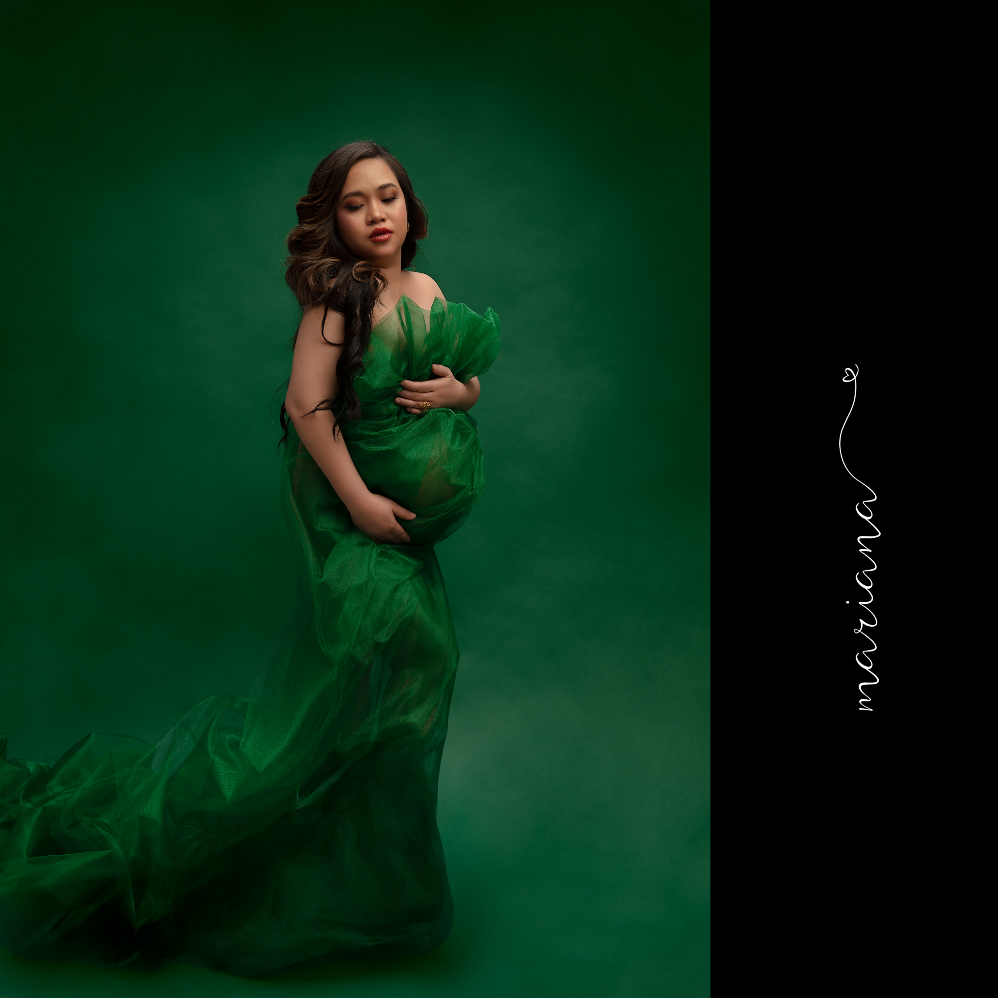 Maternity portrait in an emerald gown
