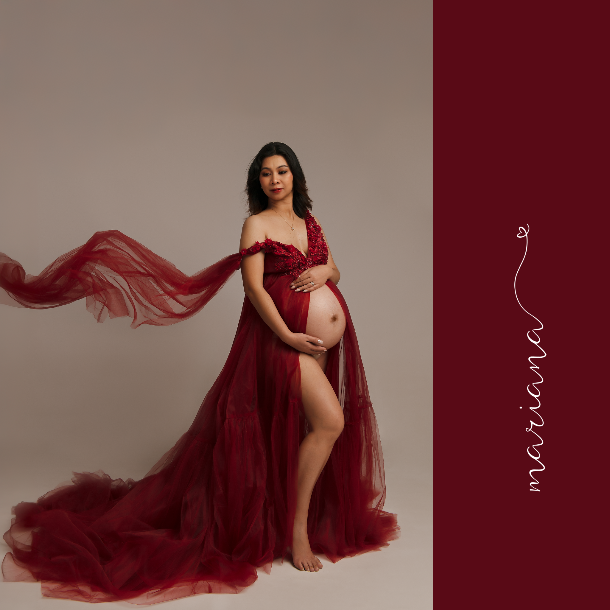 Maternity portrait in a red gown