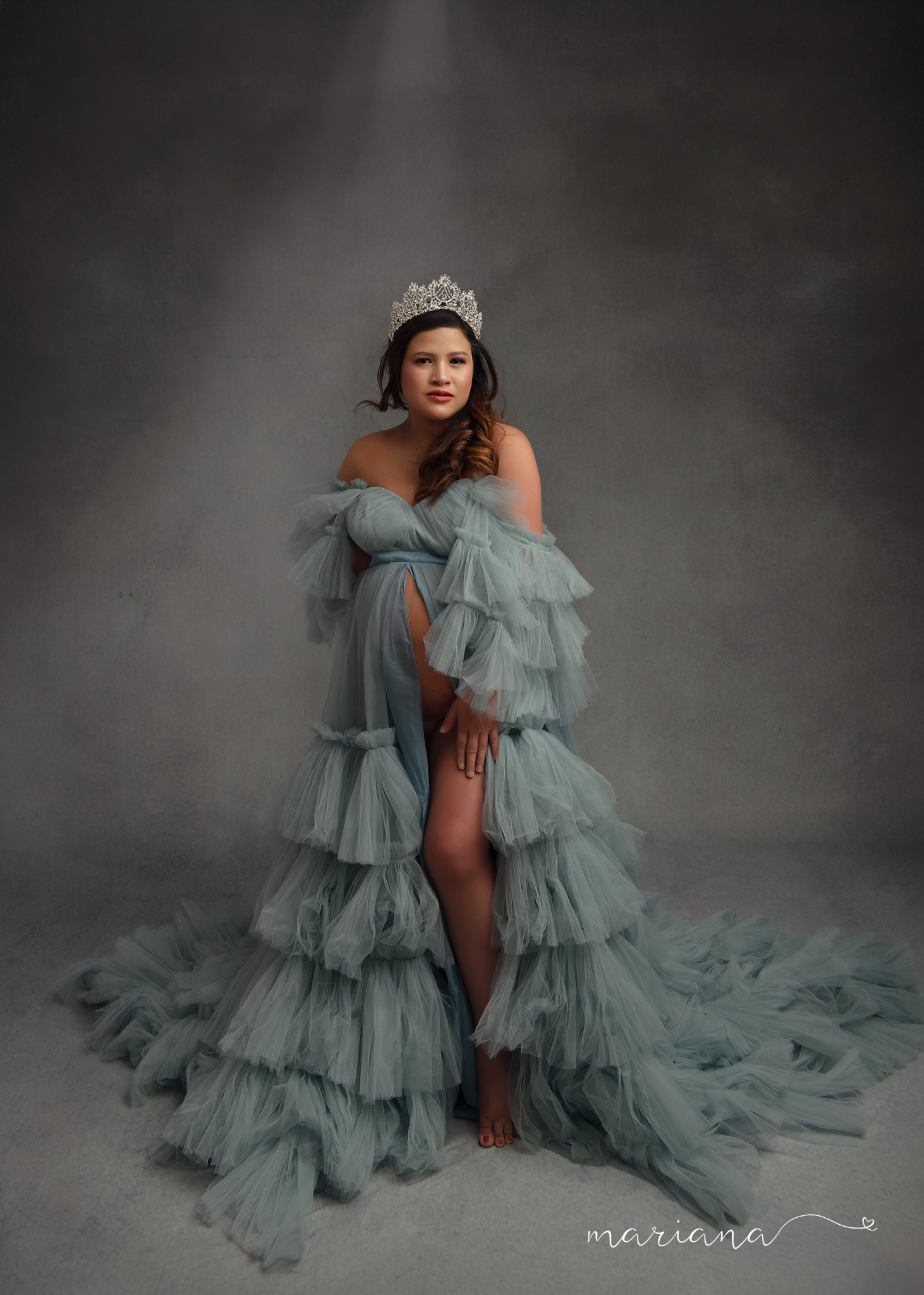 Maternity portrait in a soft blue gown